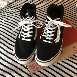 Black and white Vans high tops